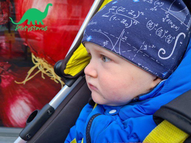 Child in pushchair wearing blue Space Maths fabric slouch beanie hat