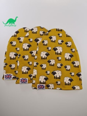 Various sizes of slouch beanie hat in ochre sheep pattern fabric