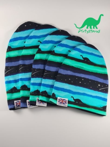 Various sizes of slouch beanie hats in midnight blue dinosaur fabric