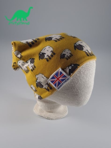 Ochre sheep fabric slouch beanie hat on crocheted baby head