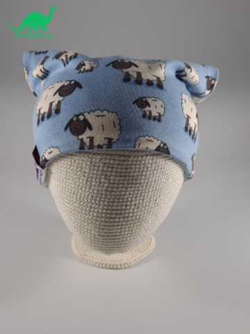 Light blue sheep fabric slouch beanie hat on crocheted baby head