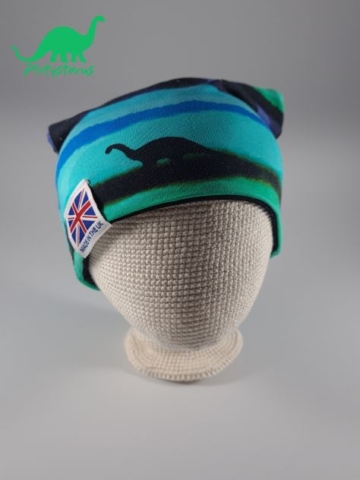 Blue midnight dinosaur fabric beanie hat on crocheted baby head